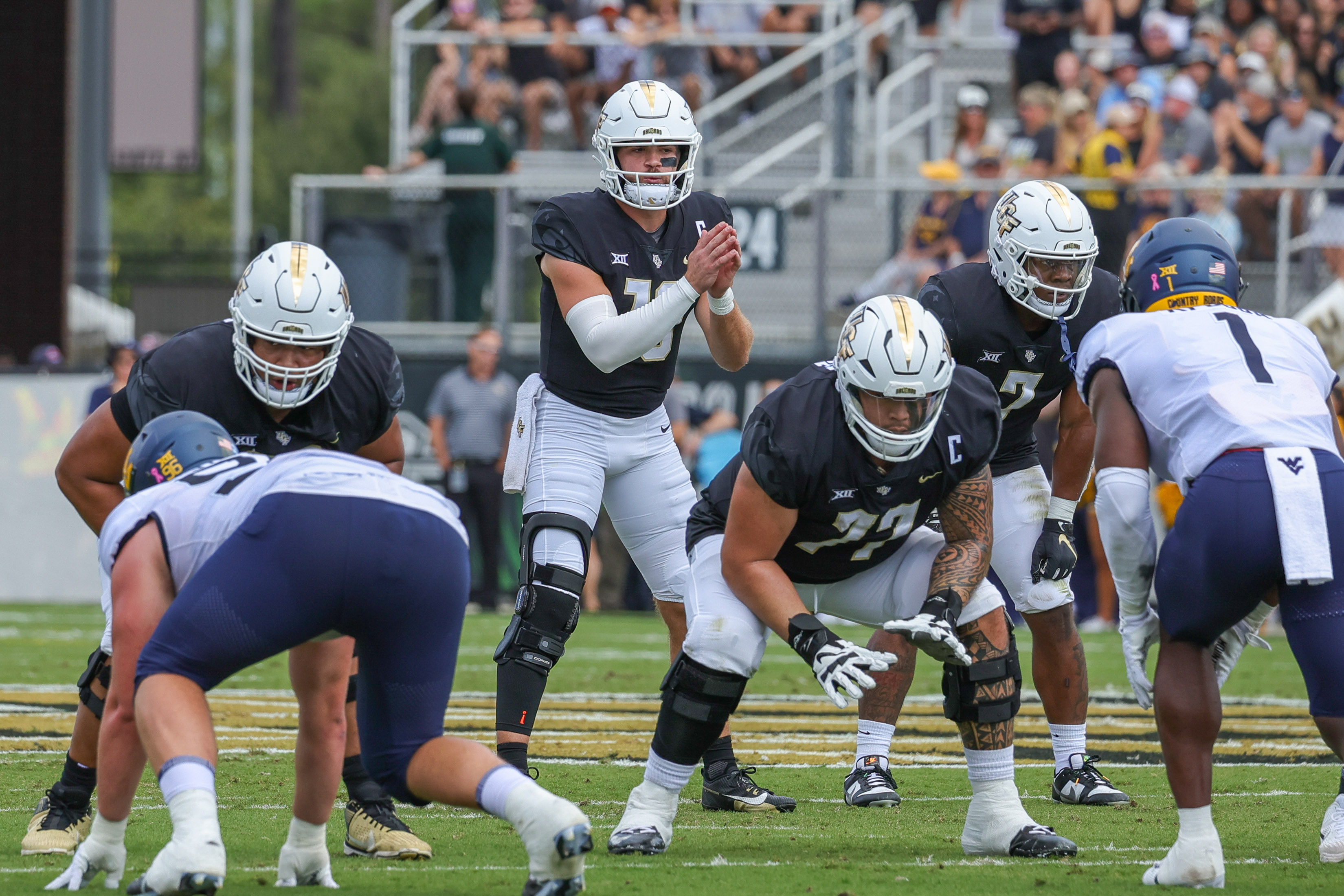 Oct 28, 2023; Orlando, Florida, USA; UCF Knights quarterback John Rhys Plumlee (10) calls for the snap against the West Virginia Mountaineers during the first quarter at FBC Mortgage Stadium. Mandatory Credit: Mike Watters-USA TODAY Sports